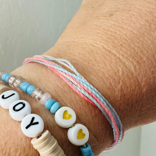 pink and blue bracelets